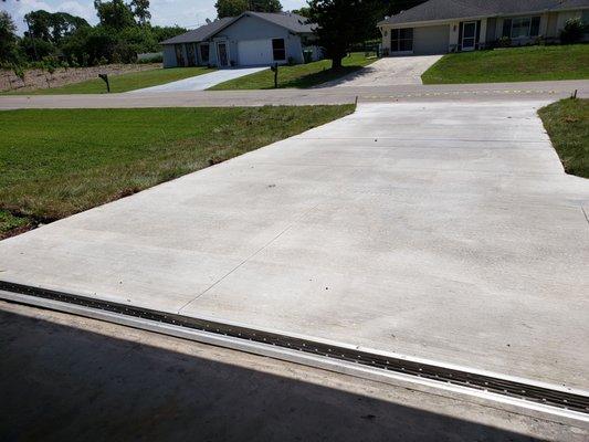 Brand new concrete driveway with culvert