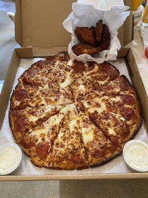 Pepperoni pizza with extra cheese and extra pepperoni. Wings came plain without Buffalo sauce which was disappointing.