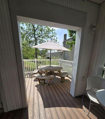 The patio sits at the top of a creek