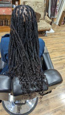 Retwist and dread extensions with curly ends.