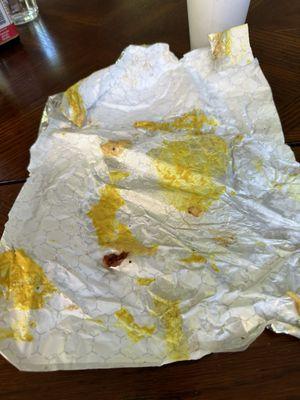 Mustard soaked wrapper and bottom bun.