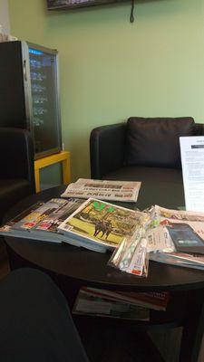 Waiting area with water, TV, and magazines