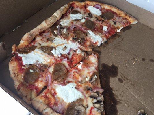 Large pizza with ricotta, onions, mushrooms and sausage.