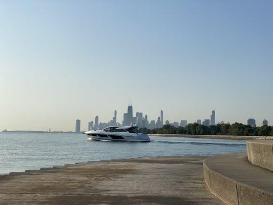 Boat coming out of Belmont Harbor. Beautiful day for be on  the lake