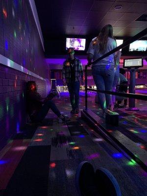 Part of our group sitting on the floor.  We has a group of 11 but only 5 people wanted to Bowled.