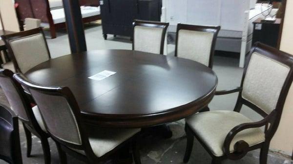 54" x 74" Hardwood table with beautiful veneer work.  A must have for the formal dinning room. Now reduced 50% to $999!