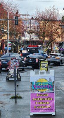 Sidewalk signage. There's the Lenin statue down the street in Fremont! (3/1/24)