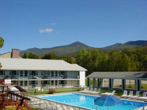 View of Front rooms, pool, shuffleboard