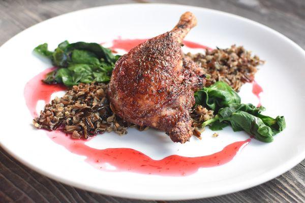 A pre-European-contact dish--Roast Duck Quarter, Sage-Scented Wild Rice, Cranberry Maple Glaze, Wilted Greens