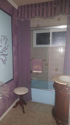 Small updates to a blue tub and purple bathroom.