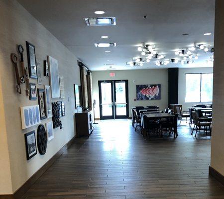 Standing at the elevators looking at the breakfast dining area in the lobby