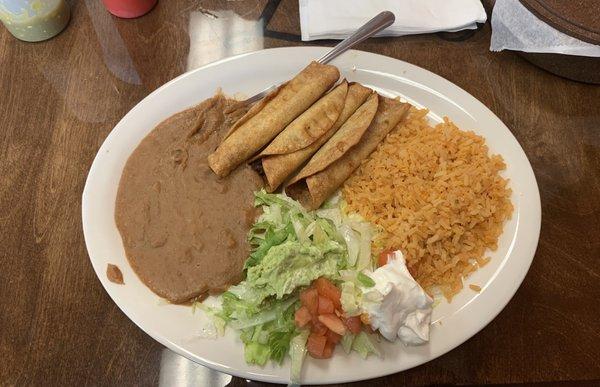 Flautas, rice, and beans.