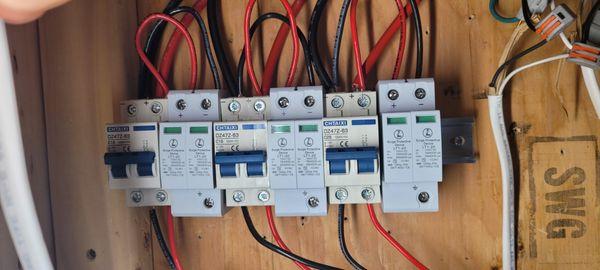 Using solar circuit breakers and surge protection devices