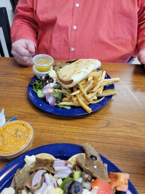 Gyro platter with fries. The fries are perfect and the Taziki sauce is top notch.