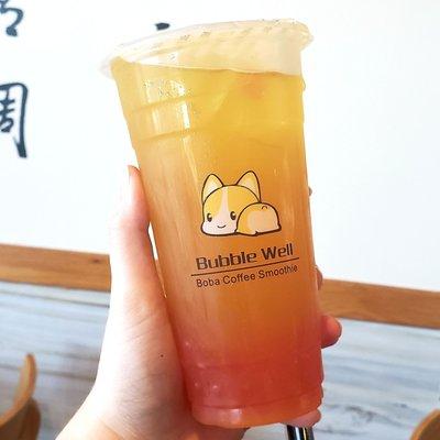 Mango tea with strawberry boba