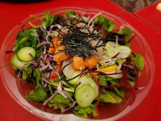 Sashimi poke over rice, $15. Tuna, salmon, flu, yellowtail over a bed of greens. Rice and sauce not pictured on the side.