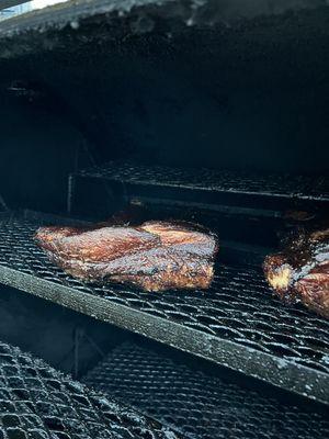 We smoke our certified Angus beef briskets with hickory and pecan wood!