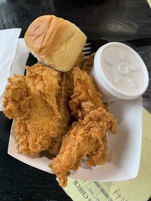 2 piece chicken tenders w/ potato wedges and gravy sauce.