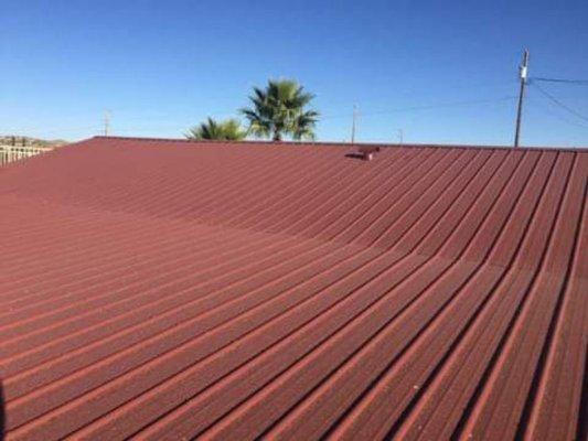 Rustic red roof on a customer's house.