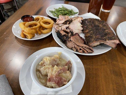 German Potato Salad, onion rings, garlic green beans, lean brisket, turkey breast, and pork ribs