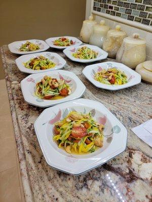 Green papaya and mango salad with cashews, cherry tomato, mint, cilantro, chili, garlic, and lime juice