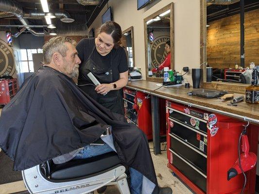 My dad getting his haircut. He already looks like a new man!