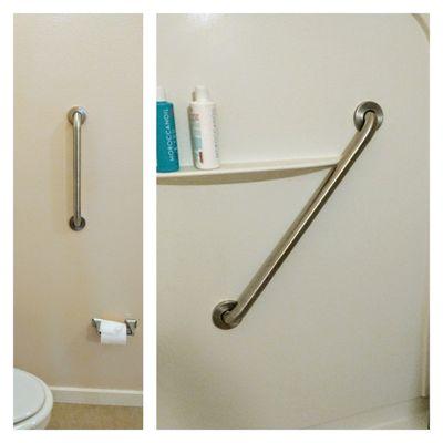 Safety grab bars installed in shower and near toilet.