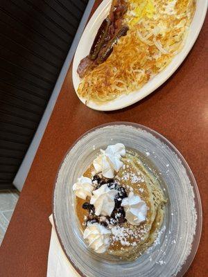 Blueberry pancakes, hash browns, eggs, sausage