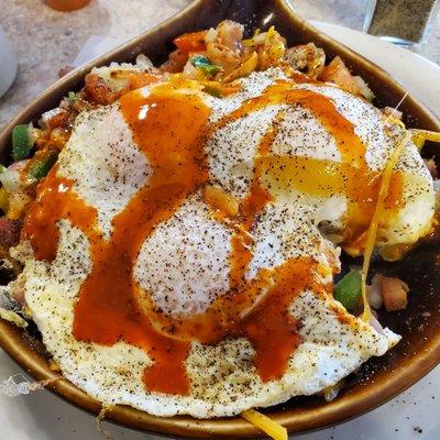 3 eggs, over easy.  Skillet with mushrooms, cheese, onions, sweet peppers and ham on top of potatoes.  Yum!