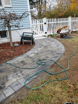 Block path that totally enhanced the curb appeal leading to the back yard.