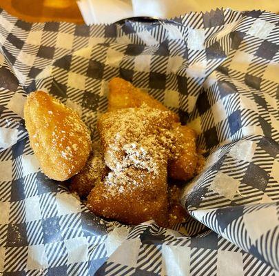 Biscuit Beignets.  They are more of a Fried Biscuit.
 Very good but not a Beignet!