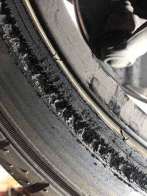 Damaged tire from rubbing against loose coil over