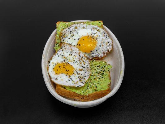 avocado toast .toasted whole grain bread with smoothered avocado 2 sunny side up eggs topped with everything bagel seasoning.