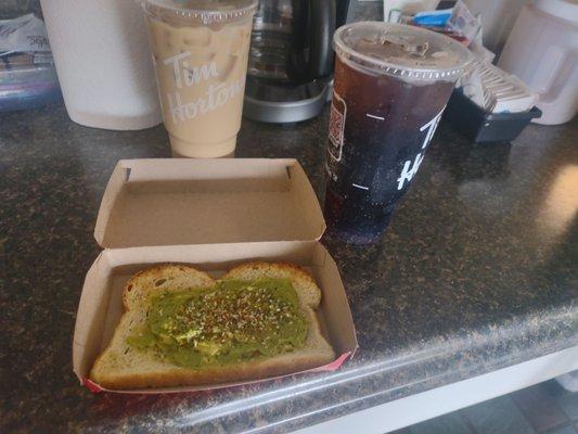 Avacodo toast with a large cat el iced coffee and a large coke