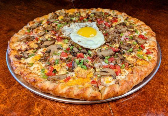 Brunch Breakfast Pizza - Homemade gravy, cheddar and mozzarela cheese, eggs, bacon, sausage, bell peppers, mushrooms, Pico de gallo