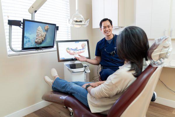 Sunnyvale dentist Derek H. Tang, DDS explaining the dental cown procedure to patient