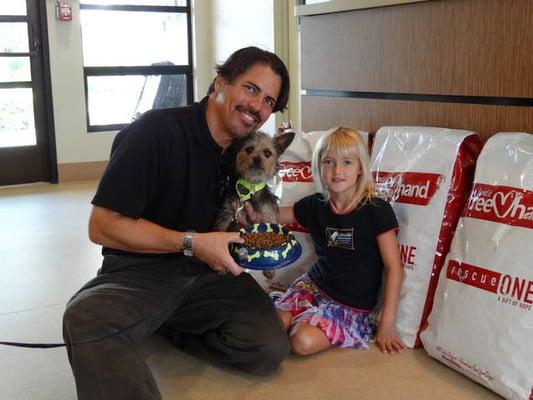 Dr. Mike bringing food for the shelter dogs.