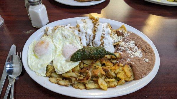 Red chilaquiles with over easy eggs