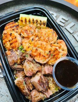 This HIbachi Plate includes 4oz of Sauteed Shrimp with 4oz. of Top Sirloin Steak on a bed of Chicken 'Fried' Rice.