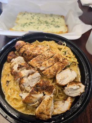 Cajun blackened chicken pasta with angel hair and cheesy bread