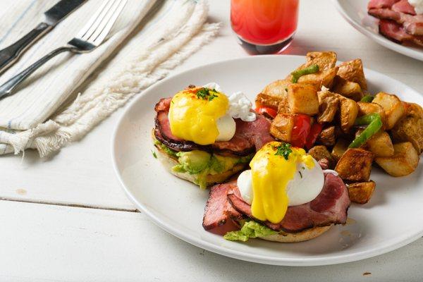 HOUSE: Hickory smoked shoulder bacon, avocado mash, poached eggs and our signature hollandaise sauce.