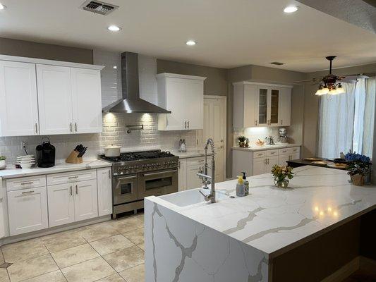 White shaker cabinets and quartz counter tops.