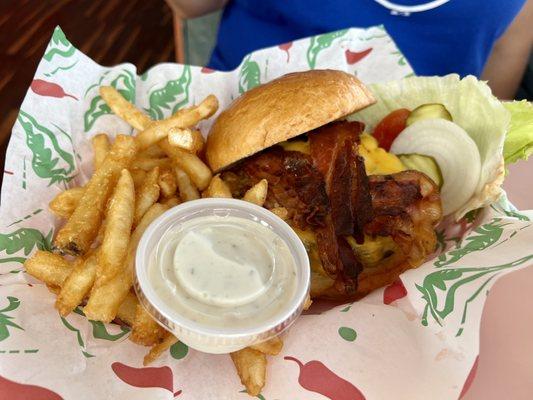 Bacon cheese burger with fries.