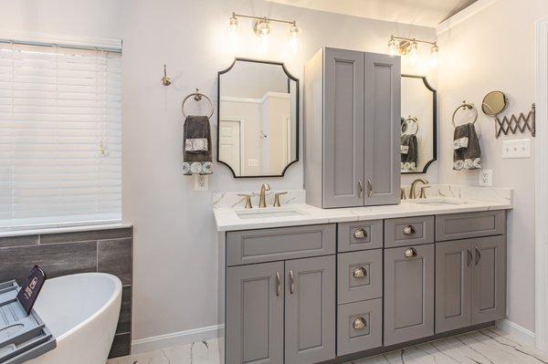 Sleek bathroom remodel in Centerville, VA with double vanity & glass walk-in shower