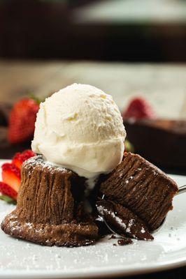 Soffiato di Cioccolato: 
Warm flour-less cake with molten chocolate center served with vanilla ice cream