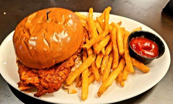 Chicken sandwich with fries.