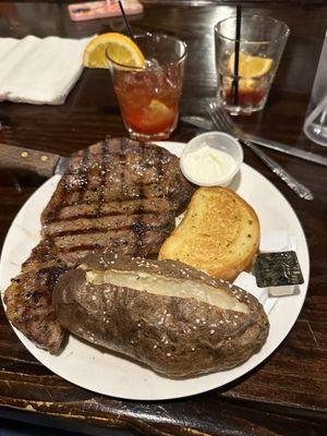 Perfectly cooked, ribeye, and large baked potato. Very good. and the old fashions were very tasty.