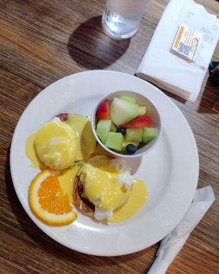 eggs benedict plus fruits and water