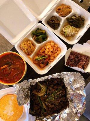 Incredible Yums! Spicy beef soup and beef bulgogi with purple rice and various banchan!