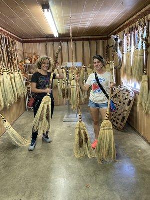 Happy girls with brooms